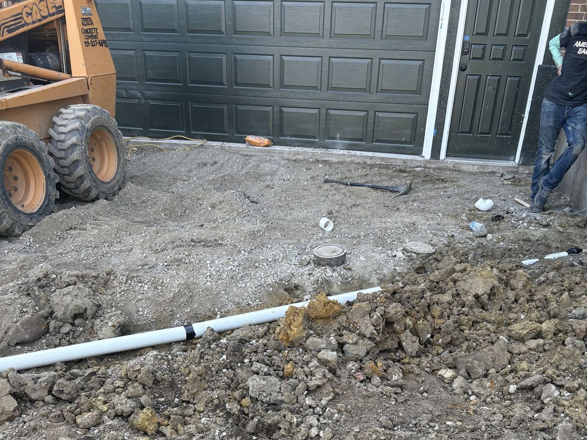 Excavated ground with drainage pipe set before the concrete goes in
