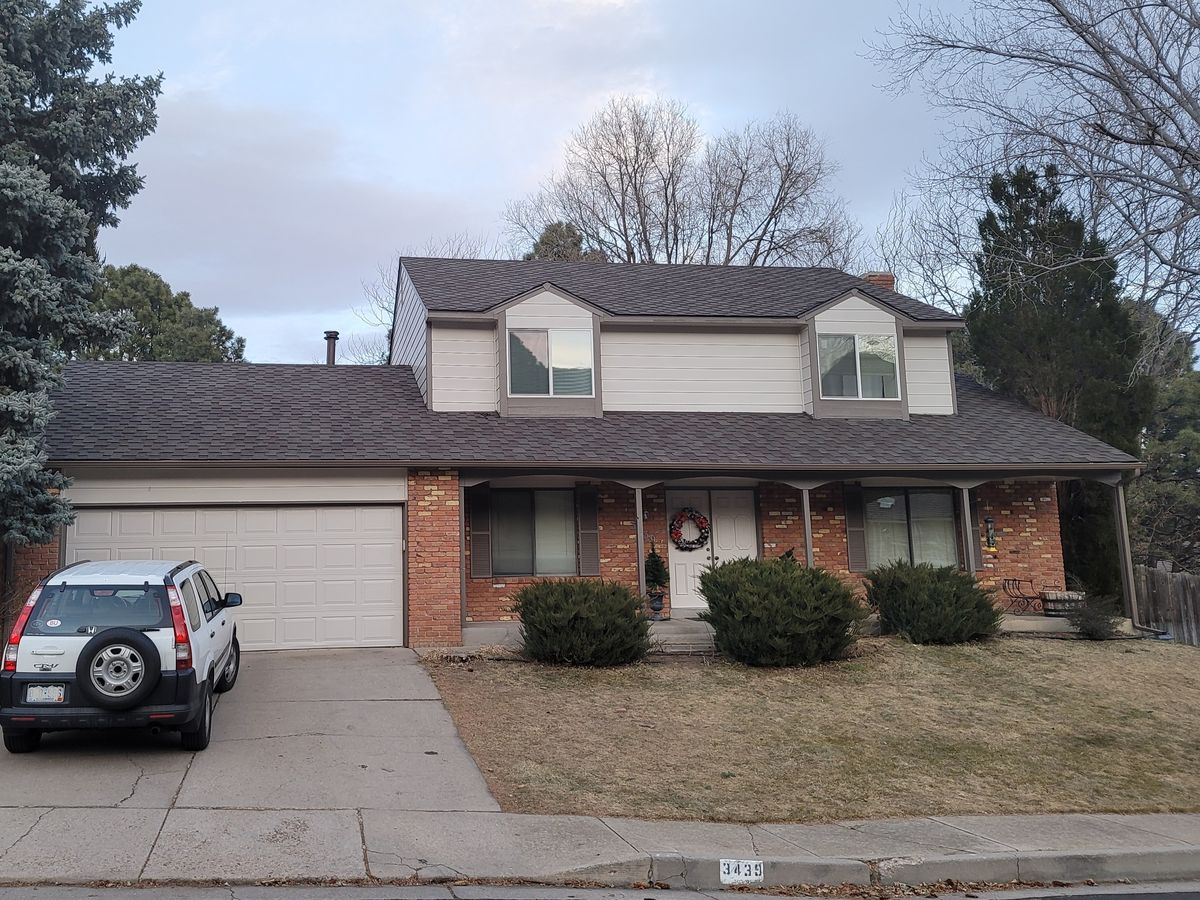 Front of a brick and siding house after an exterior repaint