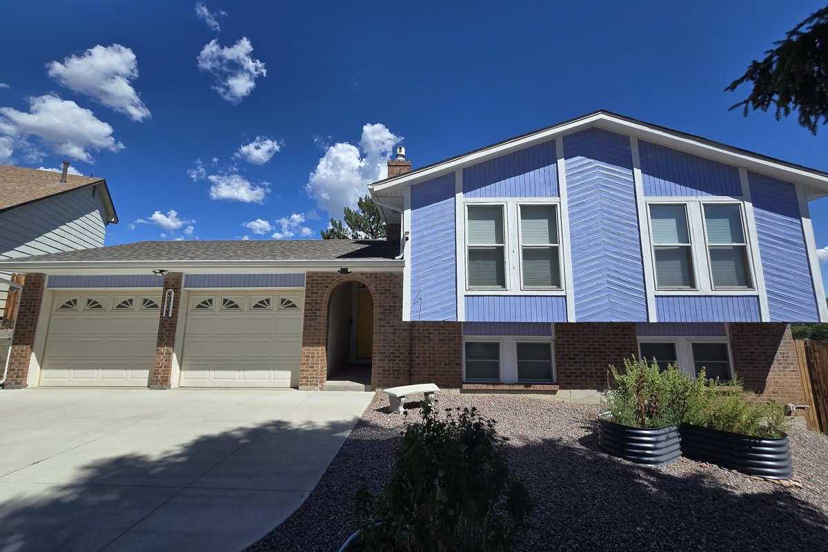 Blue and white house after a fresh coat of exterior paint