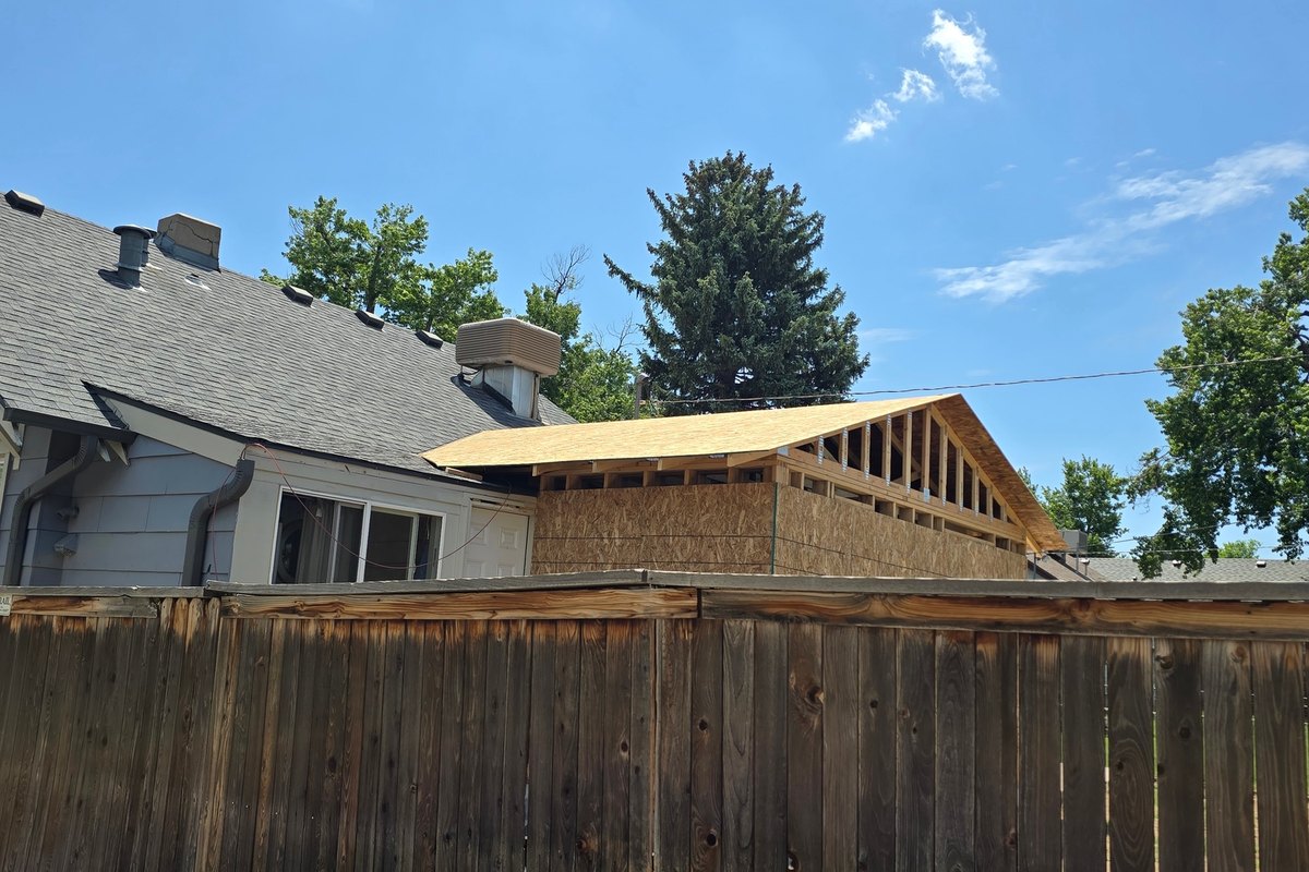 Garage roof framing opened up and rebuilt partway through a repair